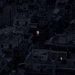 This photo is opaque black with a single point in the middle. It is titled, "The Stunning Loneliness of Megacities at Night." From Wired Magazine. April, 2019.
