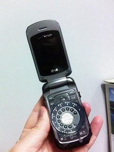 This is an picture of a flip-phone with a rotary dial. It is not common, but here is the link:
https://hackaday.com/2014/06/16/the-rotary-cell-phone/