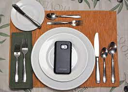 phone as a placesetting at the table