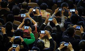 People On Phones at Conference