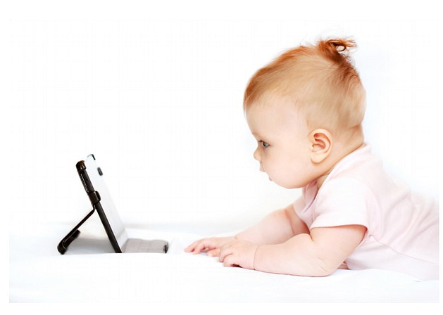 A young baby looking at at Ipad (stock photo)